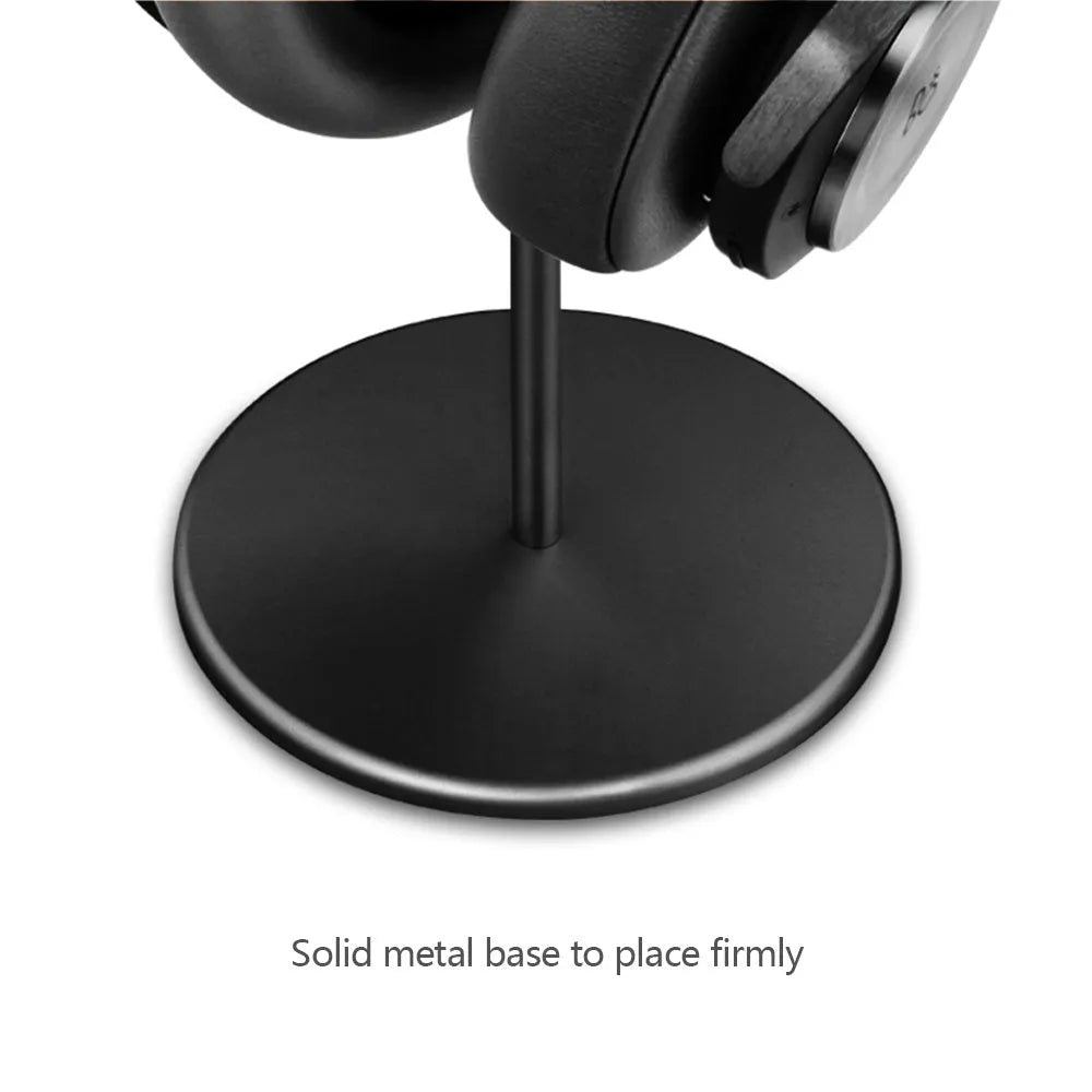 Aviation aluminium earphone holder in grey with anodized finish on a desk