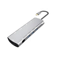 Grey aluminium USB-C docking station with HDMI, VGA, USB 3.0, and PD charging ports.