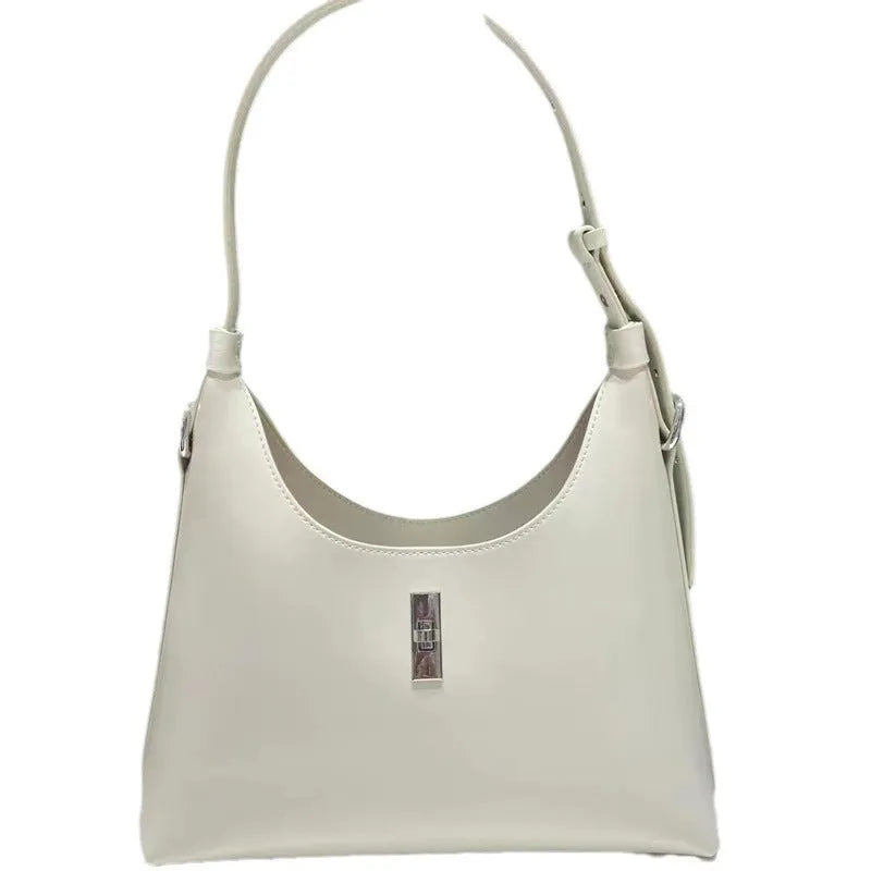 Genuine leather dumpling-shaped crossbody shoulder bag in apricot colour with street-trend details.
