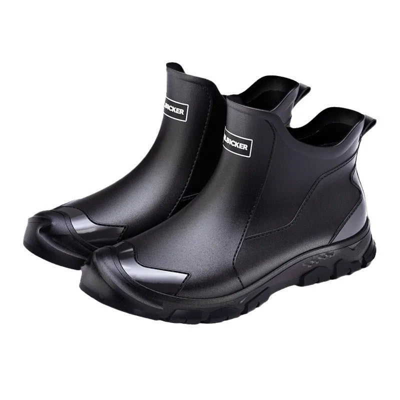 Low-cut short tube rubber rain boots in black with non-slip plastic soles.