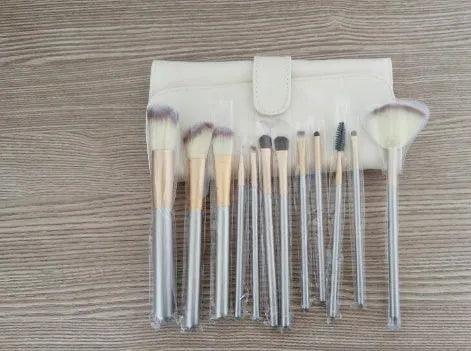 Persian make-up brush set with white synthetic bristles and champagne-colour handles in a case