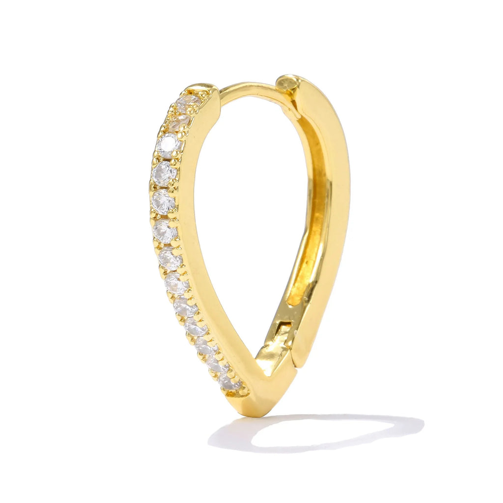 A geometric heart-shaped ear clip in a gold electroplated finish on a copper base.