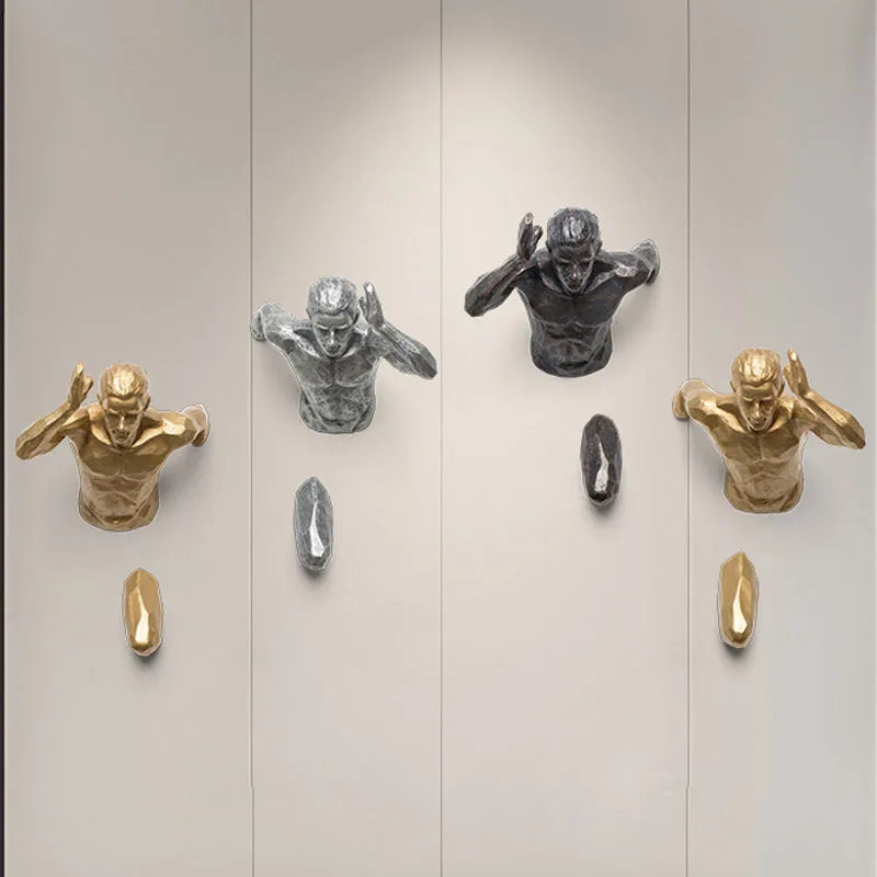 A modern, simple character silhouette wall hanging made of resin, shown in a metallic copper finish.
