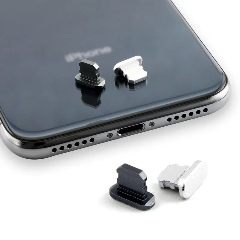 Aluminium alloy iPhone charging port dust plug shown in gold, silver, and rose gold colours.