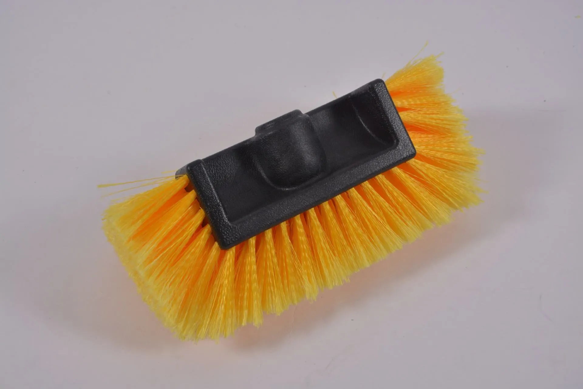 Car wash brush with four-section removable rod and flow-through head in yellow colour