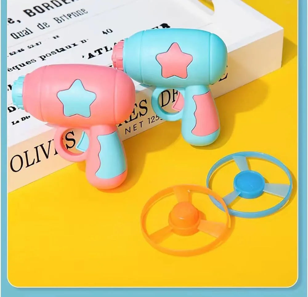 Interactive blue plastic cat toy gun with a spinning frisbee ready for launch.