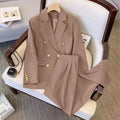 Women's loose-fit polyester blouse on a hanger, shown in a khaki colour with regular sleeves.