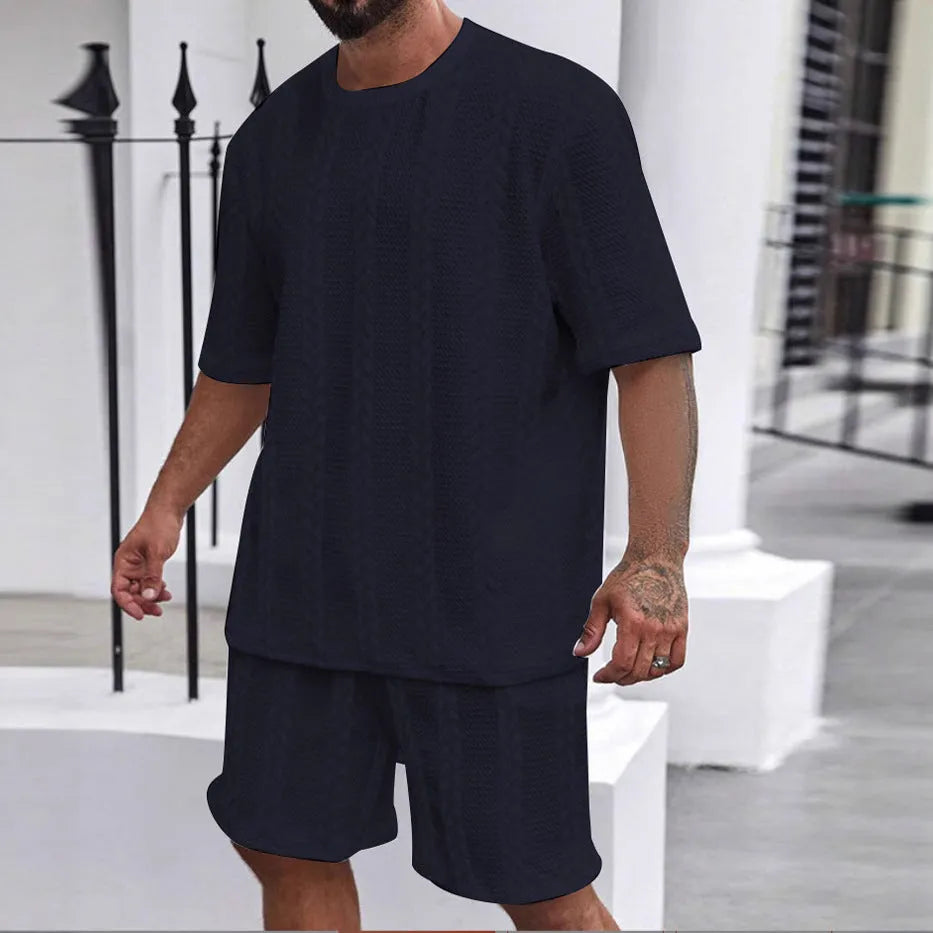 Knitted short sleeve pullover and matching shorts set in a solid colour with jacquard pattern.