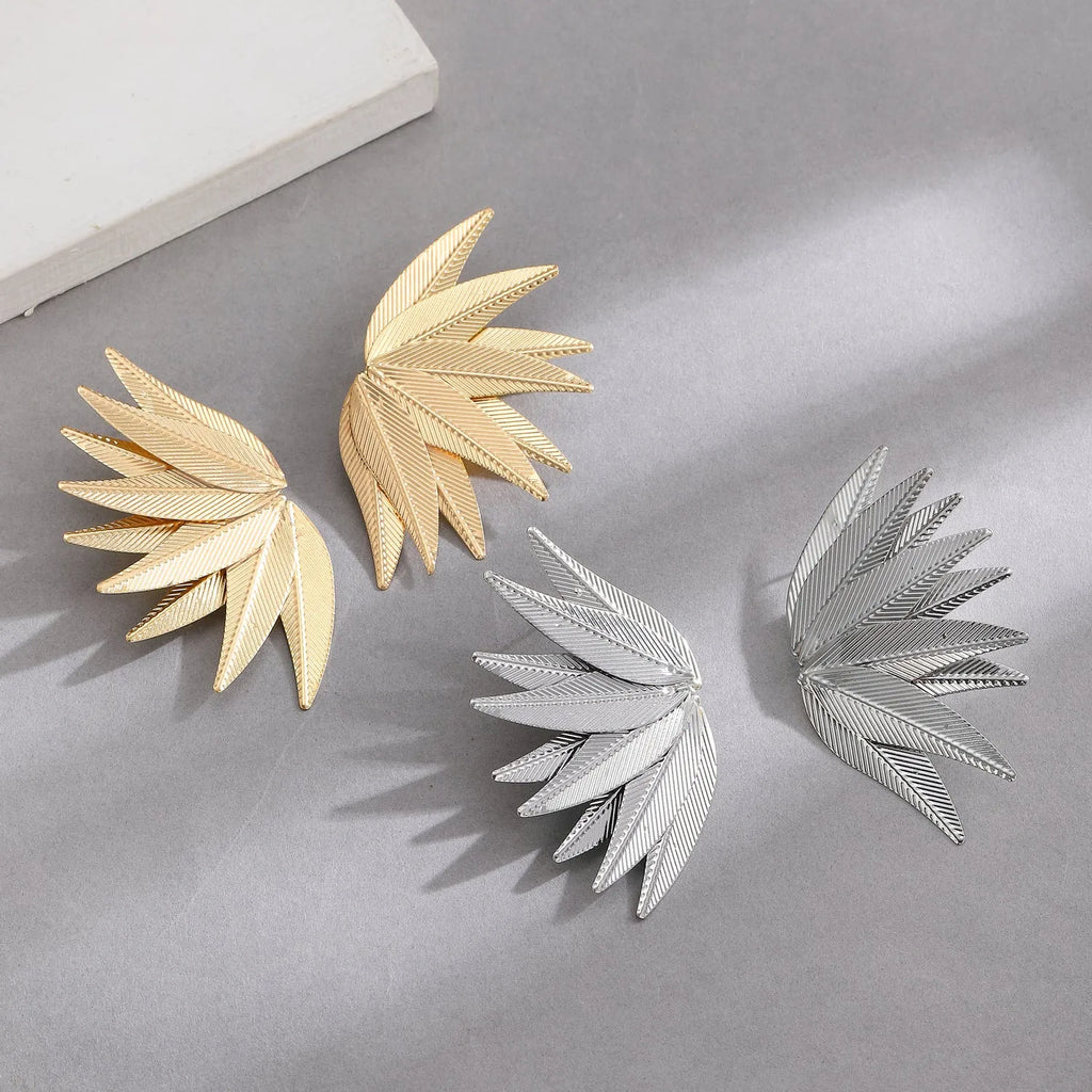 Leaf-shaped patch earrings in gold or white alloy with stud back closure