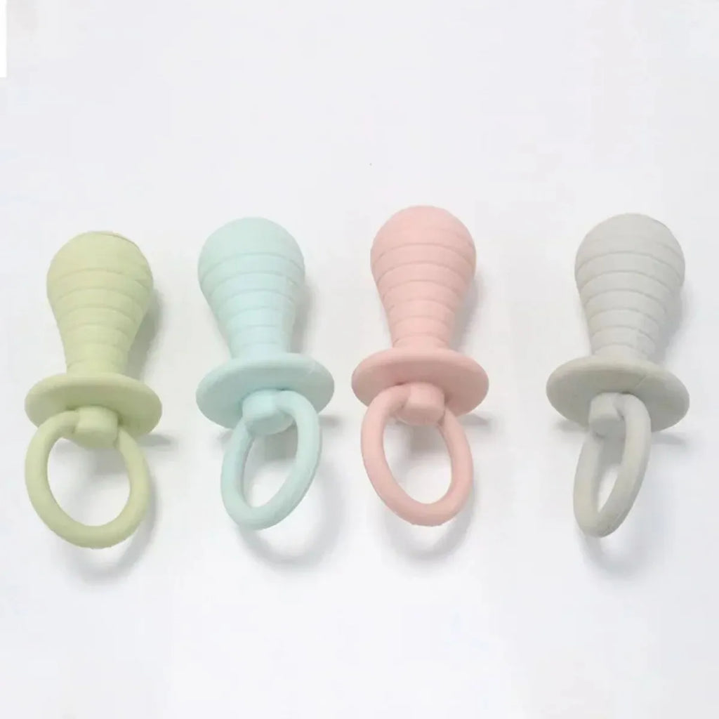 Set of four coloured TPR pet pacifier chew toys with squeakers for puppies and kittens.