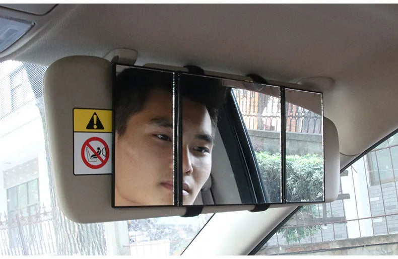 Silver portable folding car mirror shown both closed and open to double its length.