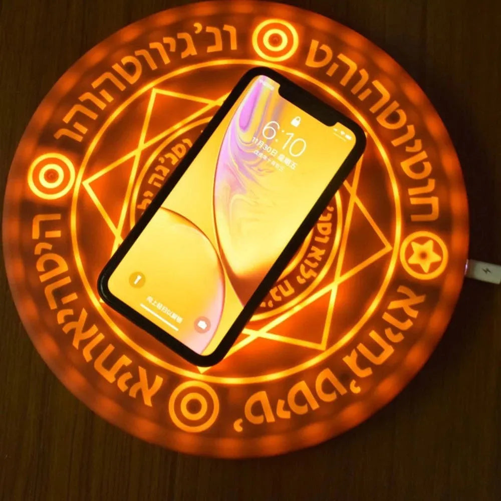 Square 25cm 10W fast wireless phone charger with glowing magic array pattern in black on a desk