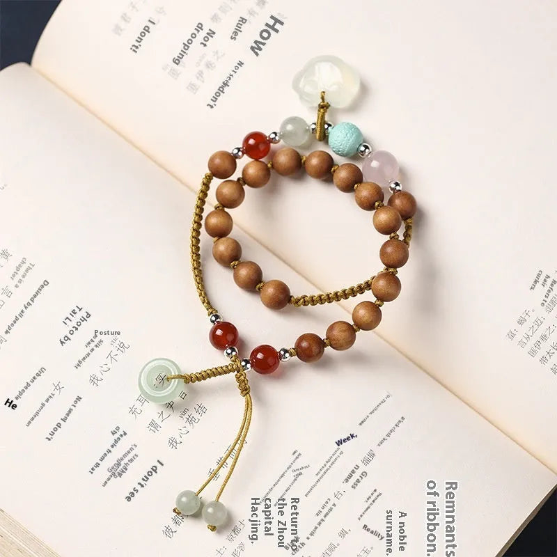 Hand-woven women's ebony bracelet with sandalwood fragrance and traditional double ring design