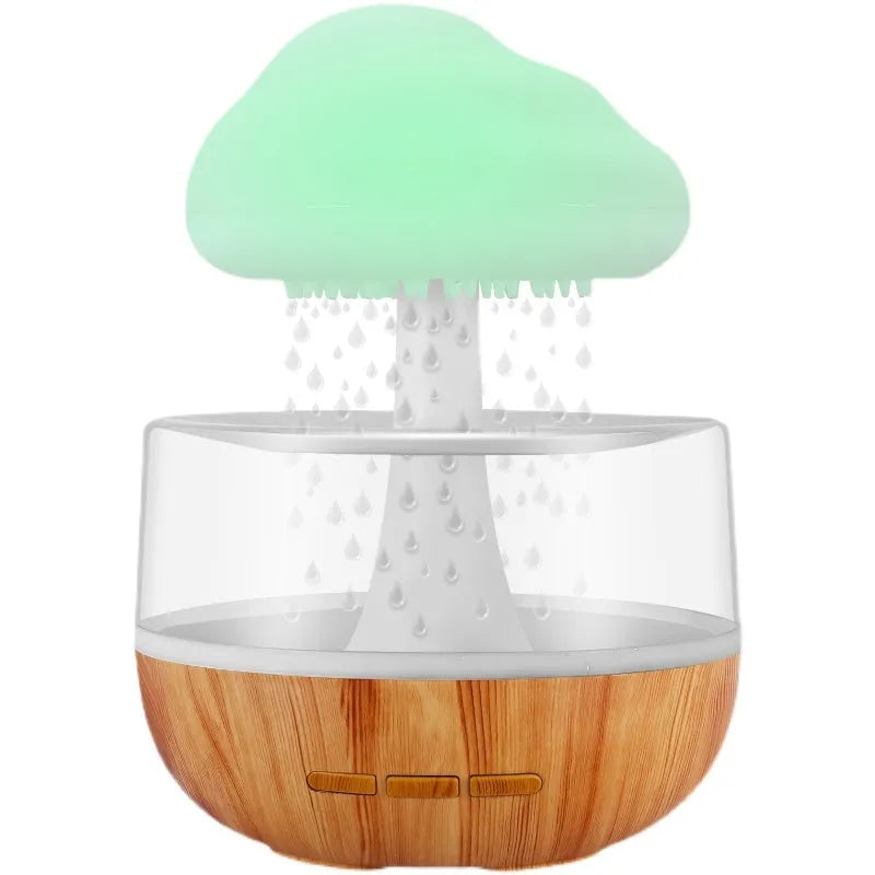White raining cloud shaped micro humidifier with night light and essential oil diffuser on desk