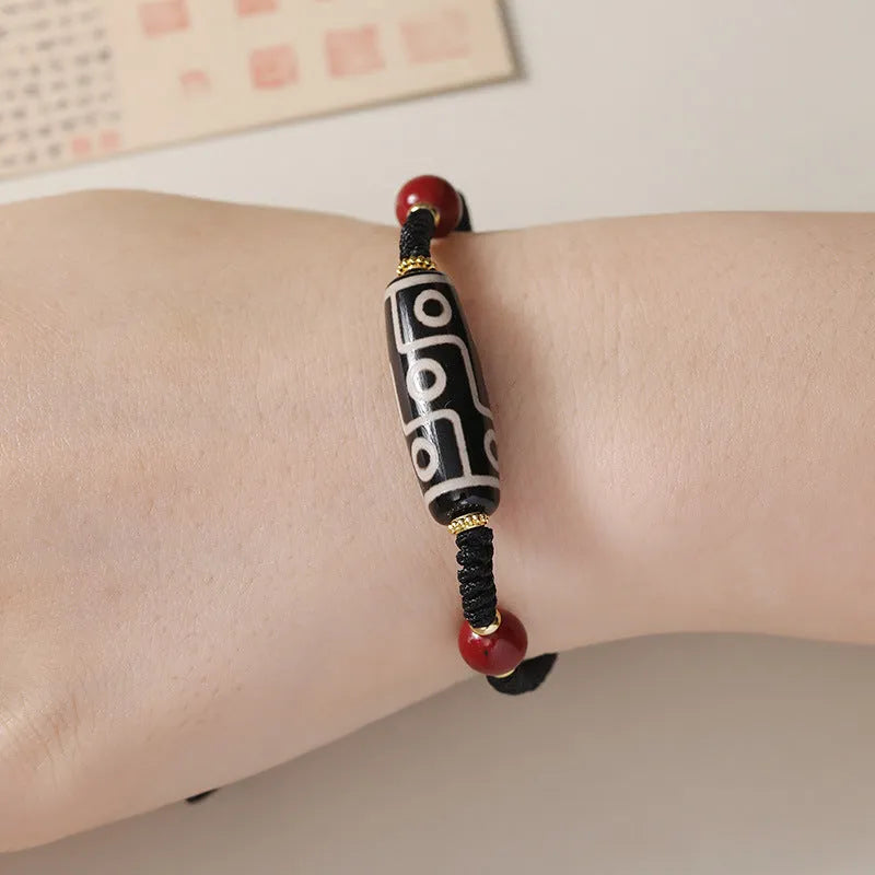 Tibetan agate dzi bead bracelet with adjustable shrinkable fit showing natural stone beads