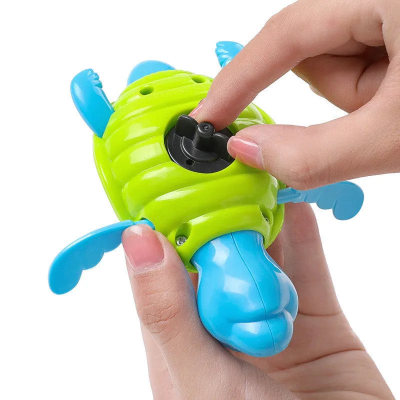 Plastic swimming turtle bath toy with brain game component for baby water play