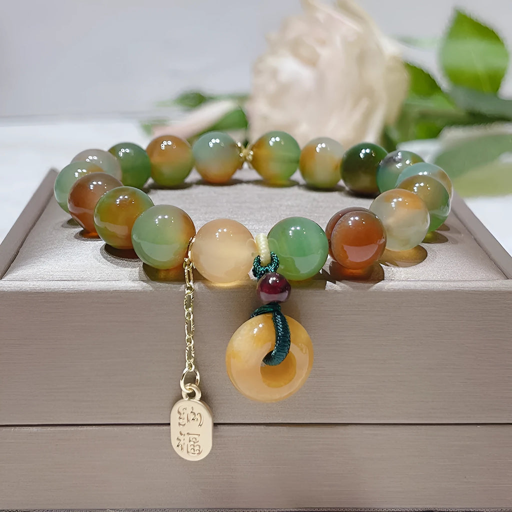 Yellow peacock agate women's bracelet with peace buckle clasp and old mine topaz accents