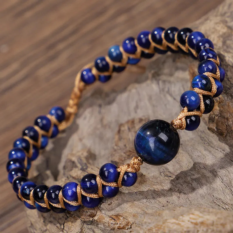 Handwoven geometric pull bracelet with blue tigereye stone beads on elastic band