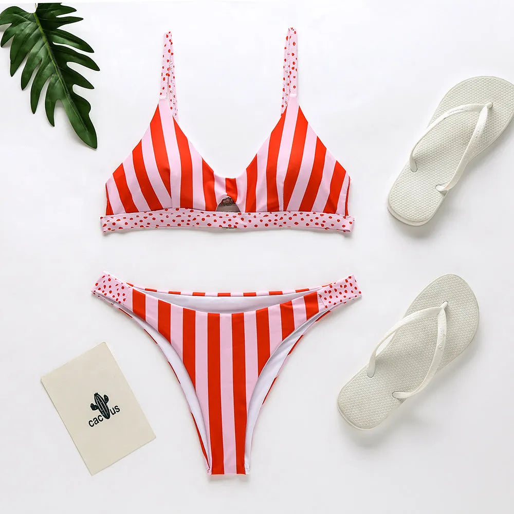 Women's bikini swimsuit in black and white dot pattern, made from polyester fabric.