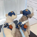 Trendy cow pet chest-back harness with hand-holding rope in British style on a dog, sizes XS to XL