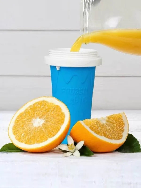 Blue quick refrigeration pinch cup with cylindrical shape and double-layer silicone construction on a table.