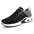 Men's Flyknit mesh low-top casual sneakers in black and grey colourway with lace-up front.