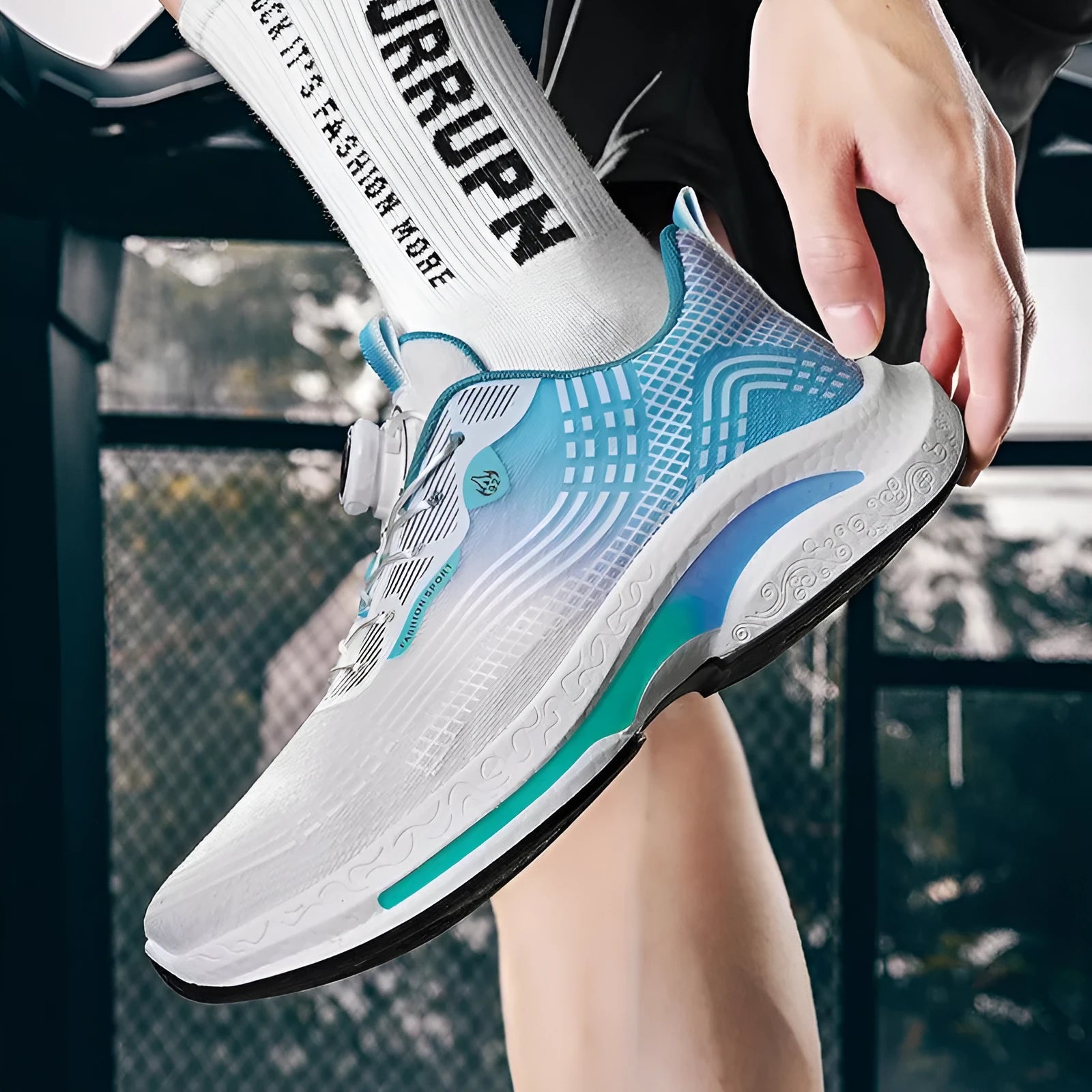 Men's low-top mesh sneakers with a rotating buckle fastening in white and blue colourway.