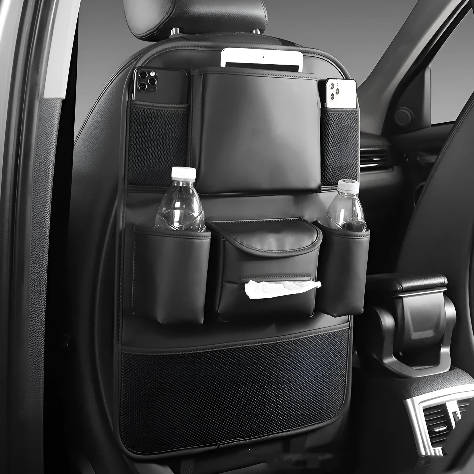 Genuine leather car seat back storage bag hanging from vehicle seat