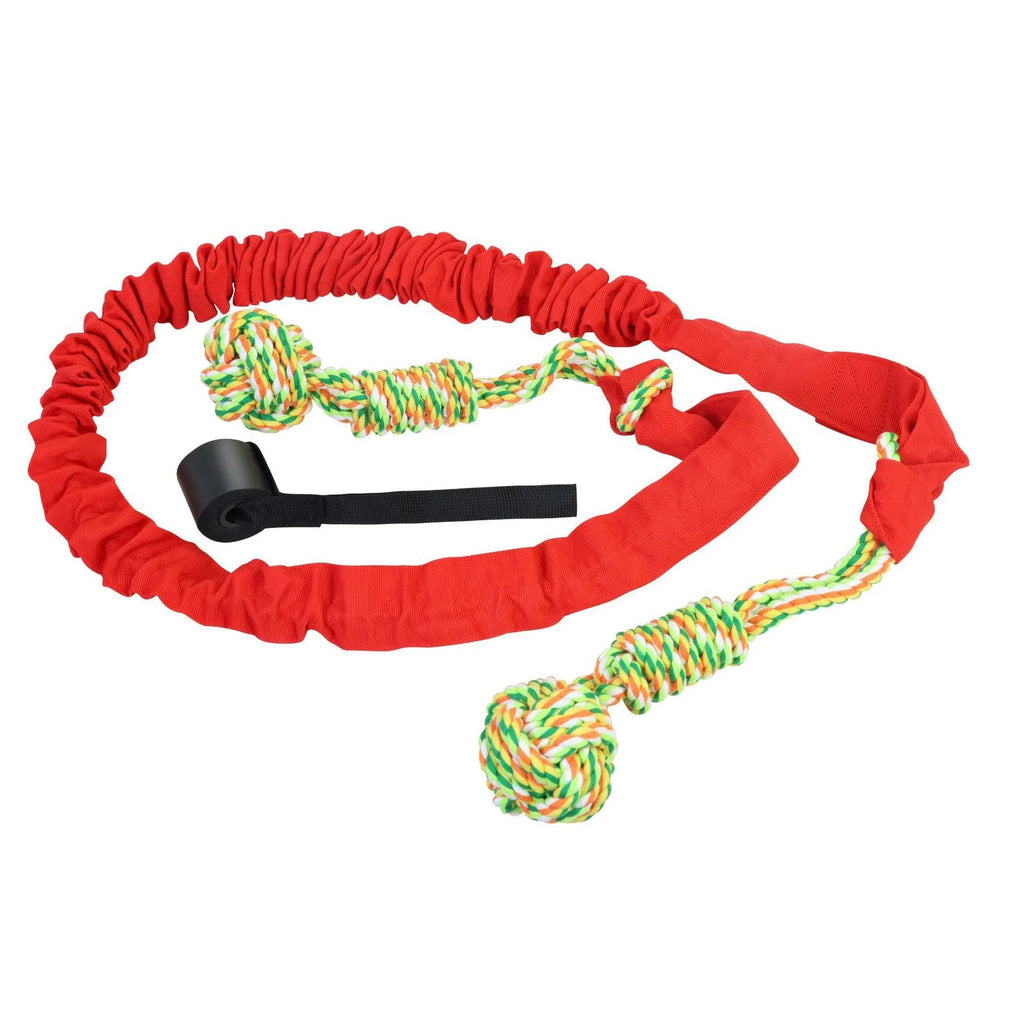 Cotton dog tug-of-war rope toy in red, shown being pulled by a dog and owner.