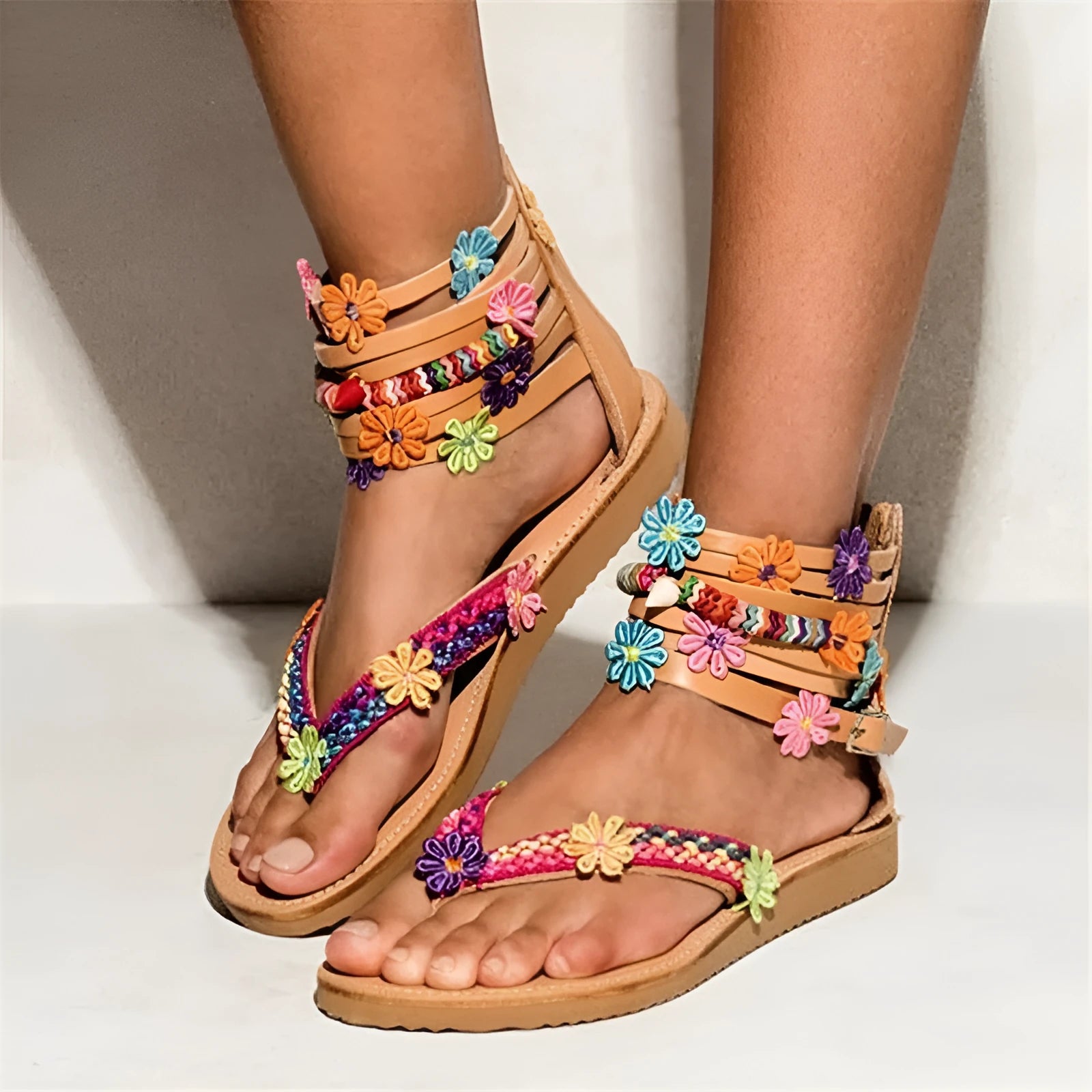 Ethnic style beaded petal sandals with floral design and round toe on artificial PU upper.