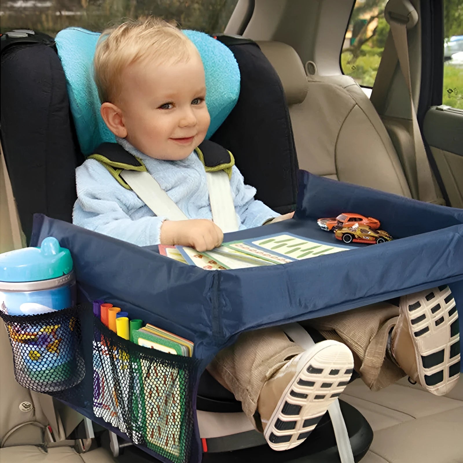 Dark blue waterproof polyester children's table tray on a car seat.