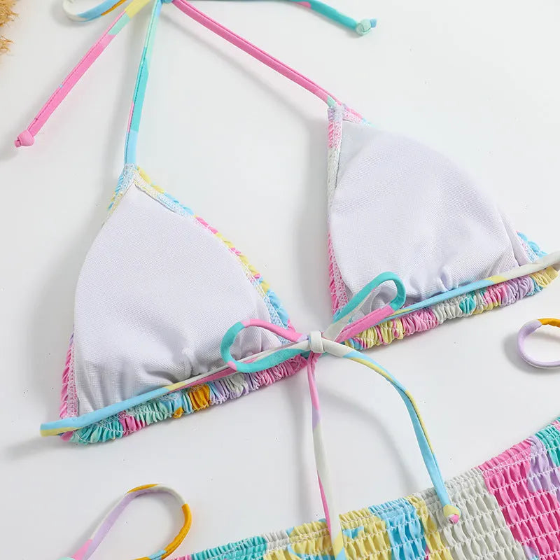 Women's floral print triangle bikini with smocking detail on the briefs, shown in multicolour.
