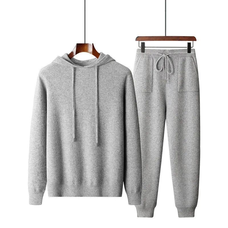 Men's light grey hooded knitted sweatshirt and matching long trousers casual set.