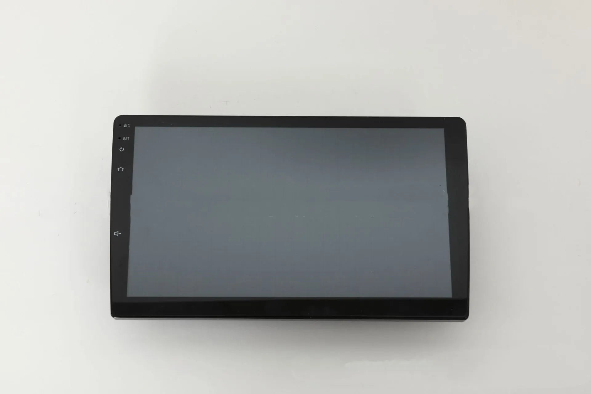 10.1 inch trapezoid Android car stereo head unit with touch screen display on a dashboard