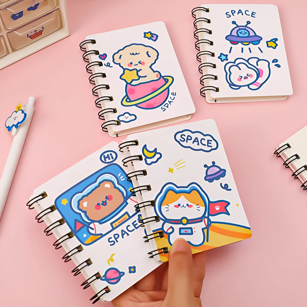 Astronaut-themed pocket flipper notebook showing compact 10.5cm by 8cm dimensions with flip-style binding
