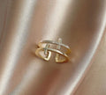 Women's adjustable copper ring featuring a miniature double cross design with sterling silver and zircon inlay.