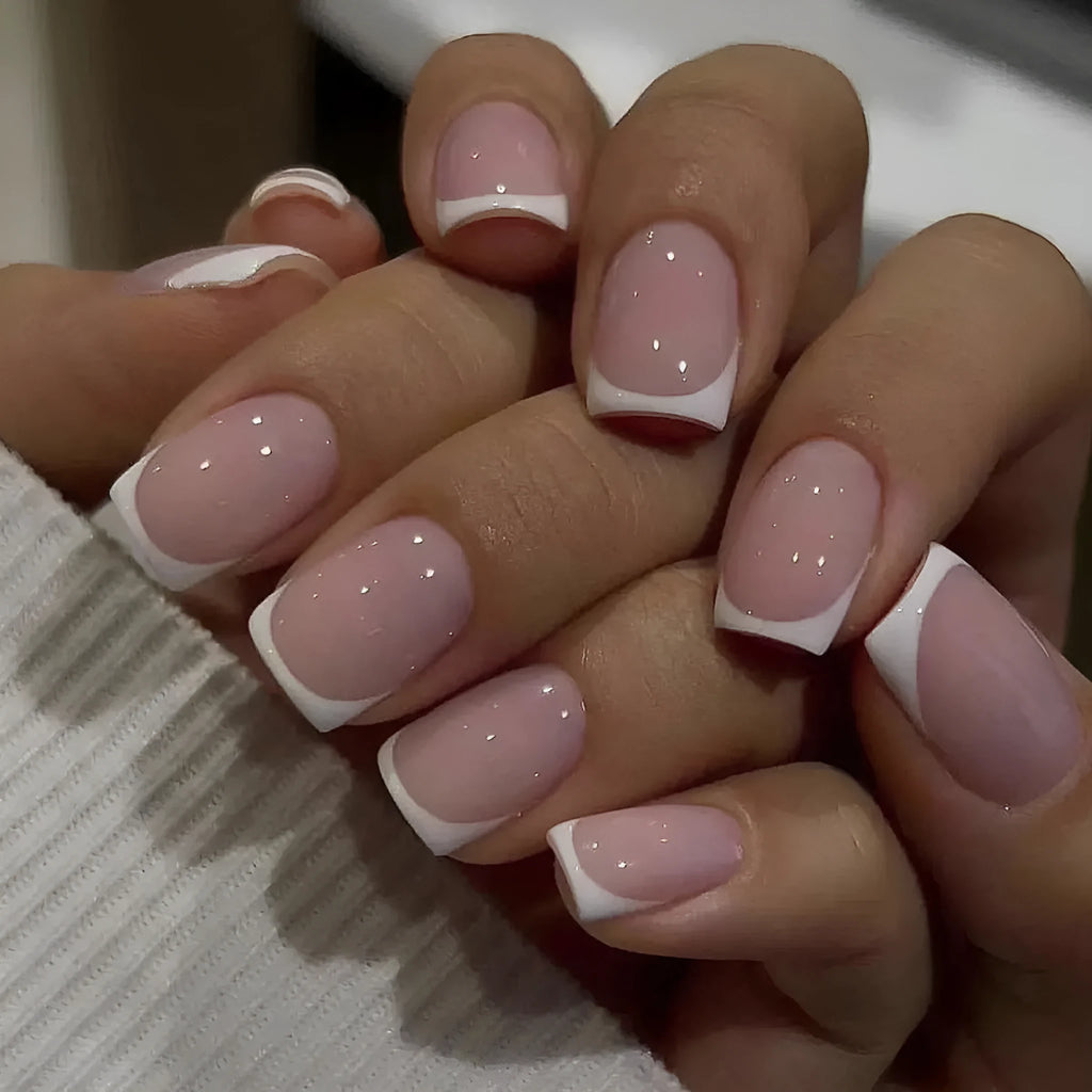 White plaid pattern fake nail tips showing geometric design on 24 nail plates