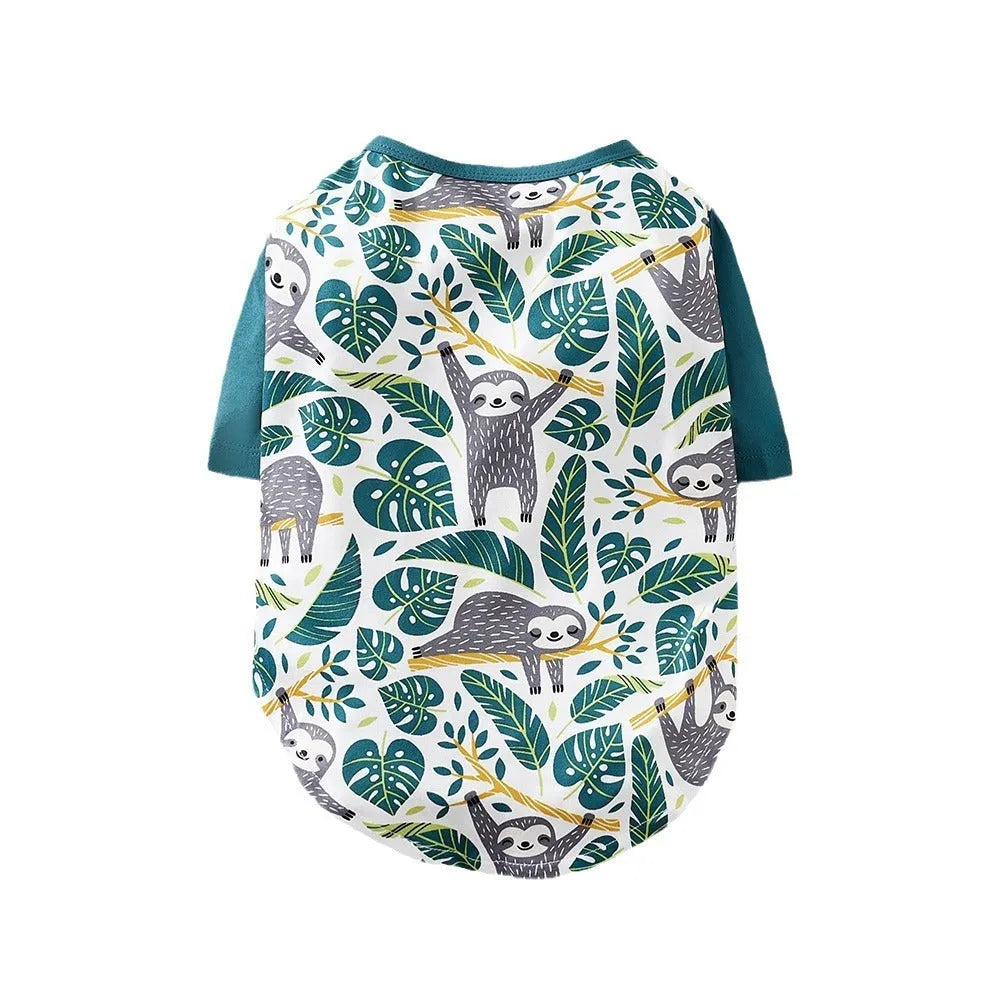 Colourful printed dog t-shirt on a small dog, showing the casual fit and full graphic design.