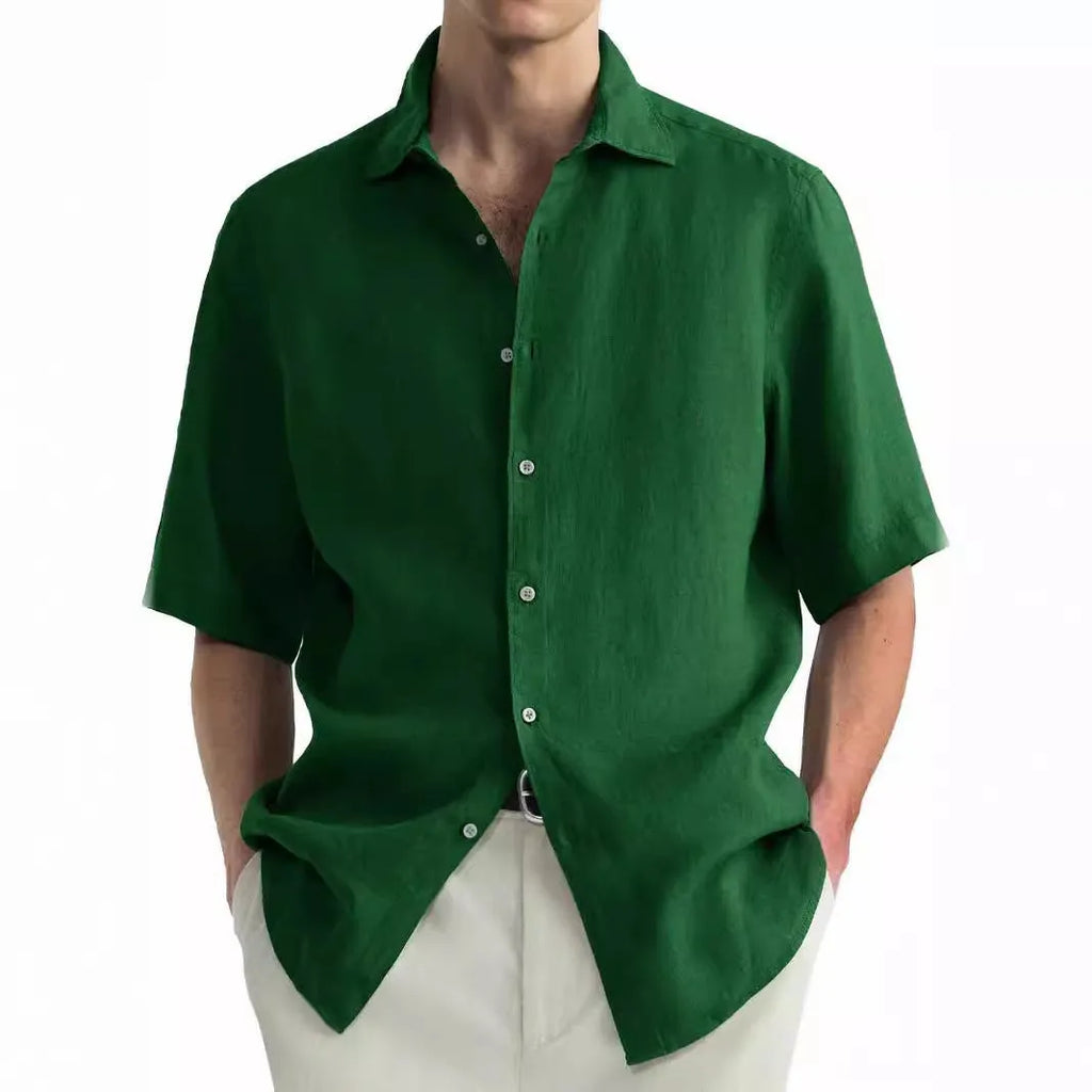A man wearing a green washed cotton casual shirt, regular fit.