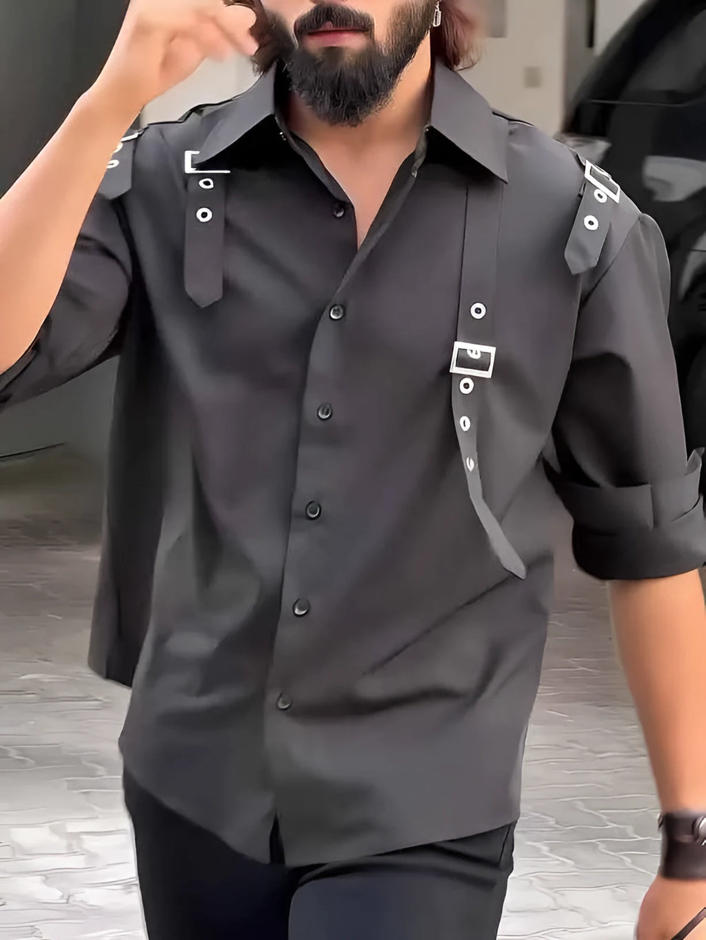 Men's black utility-style button-up shirt made from polyester on a hanger.