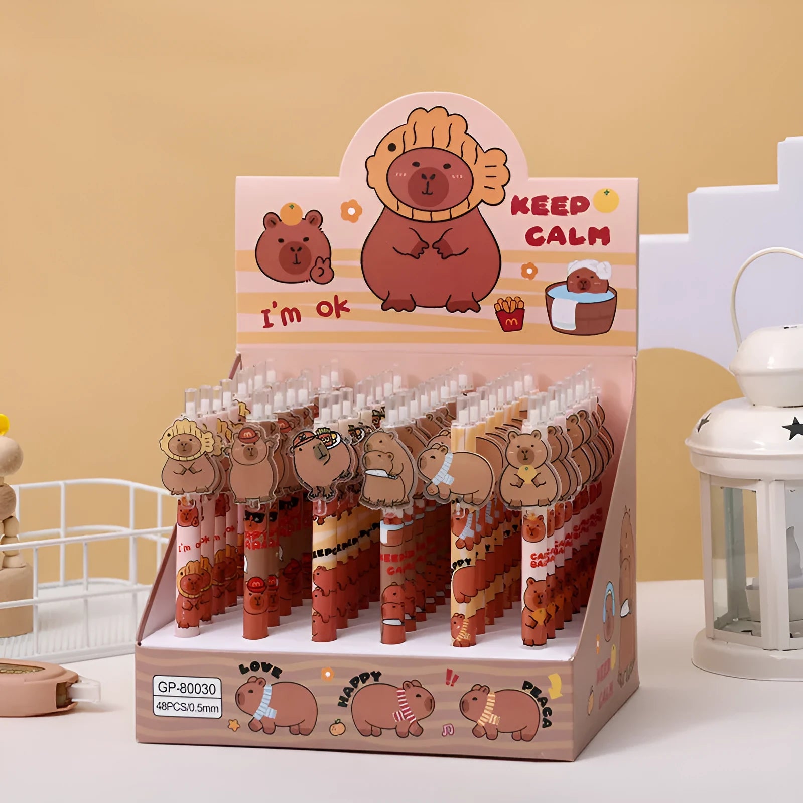 Open box showing 48 cartoon bear design acrylic gel pens with plastic bodies and black ink.