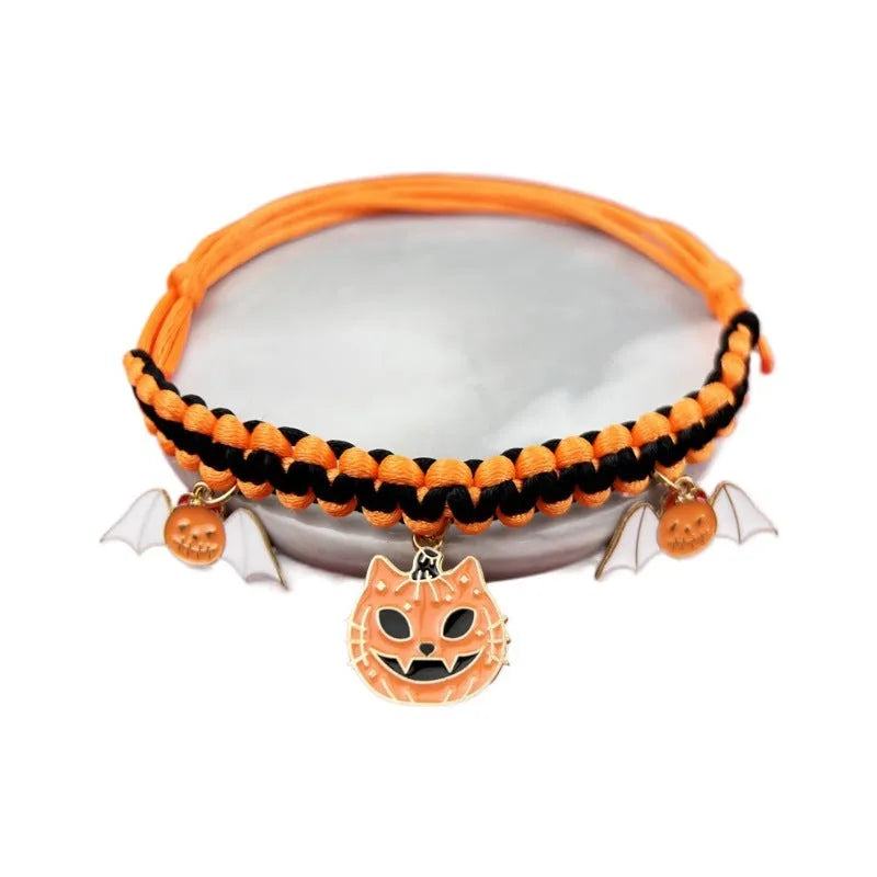 Halloween pet collar with zinc alloy charm showing pumpkin bat design on adjustable black webbing