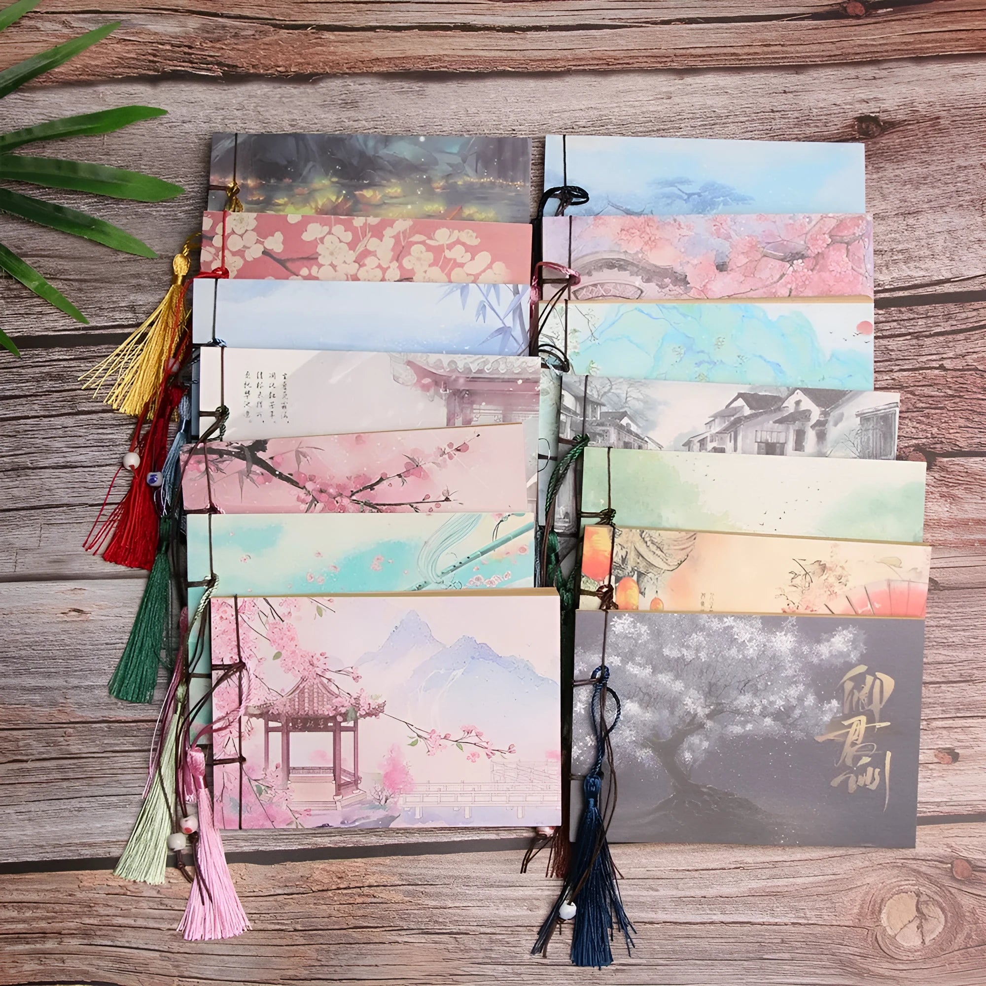 Kraft paper notebook with a tied tassel on the cover, showing hand-stitched spine.
