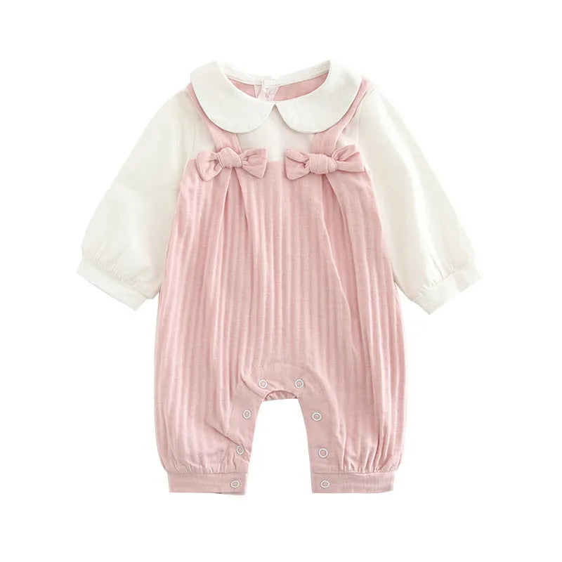 Pink baby girl's embroidered long sleeve cotton jumpsuit on a hanger