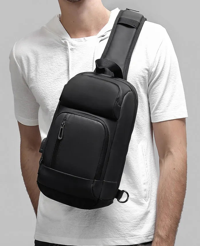 Black medium outdoor shoulder bag with square shape and air cushion strap