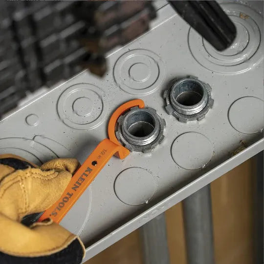 Crescent magnetic suction and catheter locking wrench three-piece set in orange, grey, and black.