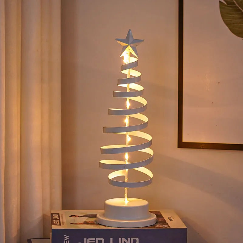 Wrought iron LED Christmas tree light with spiral design and warm white illumination on table