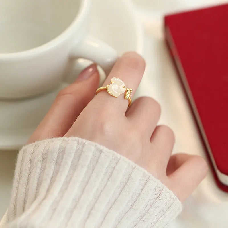 925 sterling silver jade hare ring with round shape and adjustable opening on white background