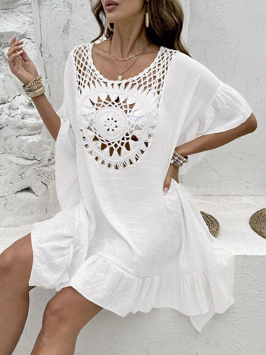 Apricot crochet stitch tassel dress on a hanger, showing patchwork skirt detail.