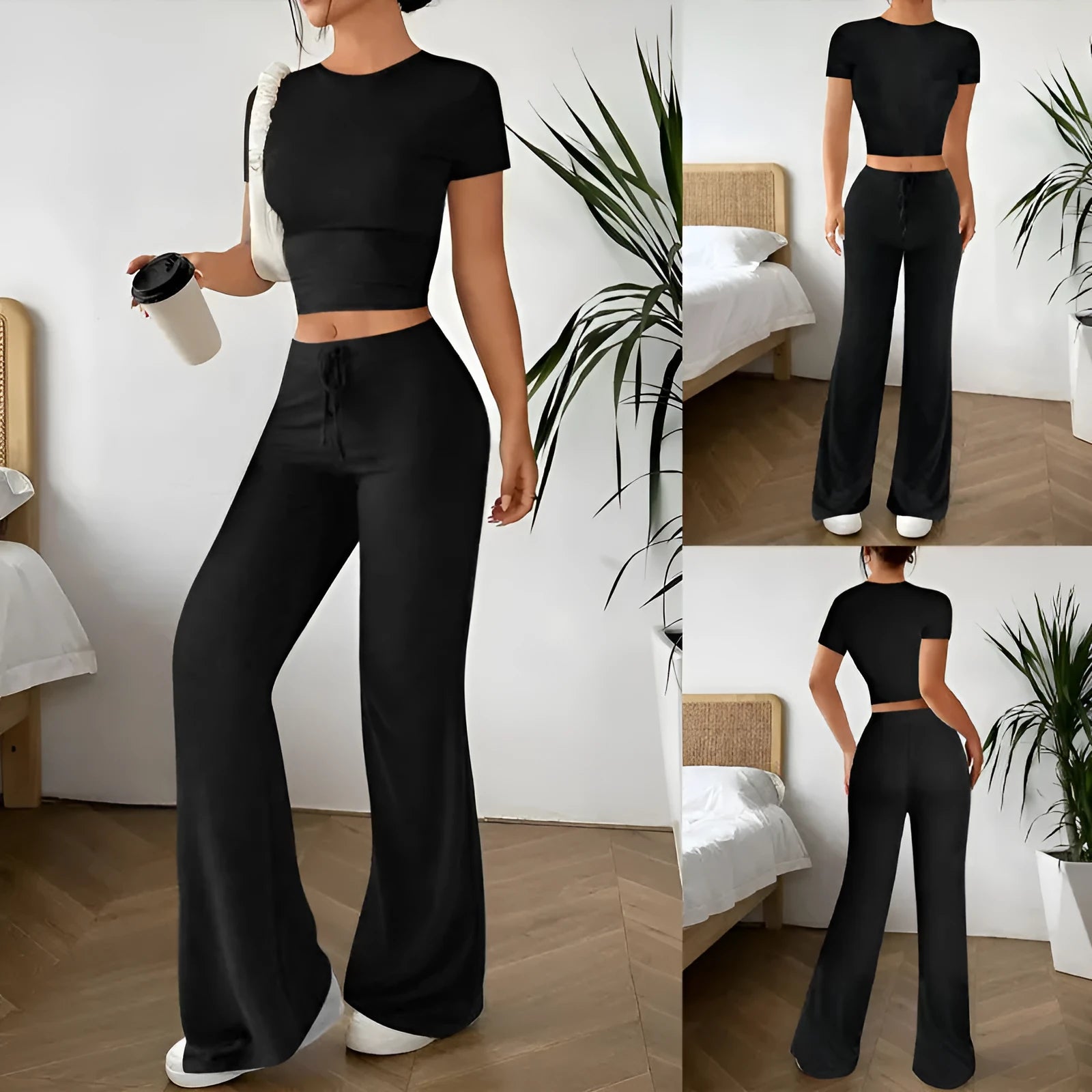 Black high waist trousers and short sleeve t-shirt co-ord suit set on a hanger.